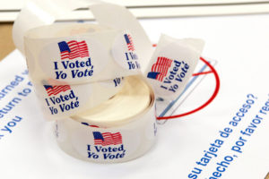 a pile of "I Voted" bracelets